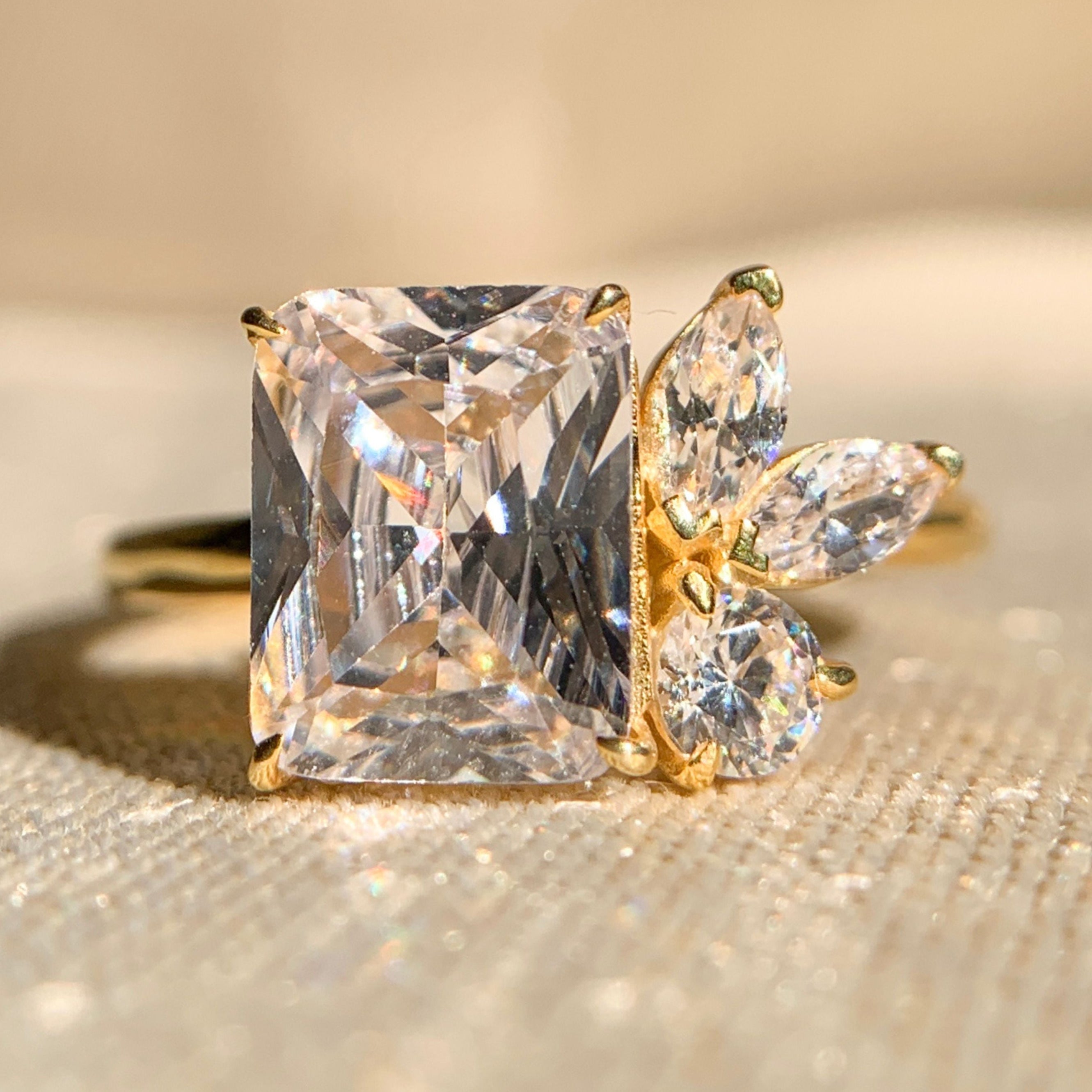 Emerald cut moissanite engagement ring with classic solitaire setting